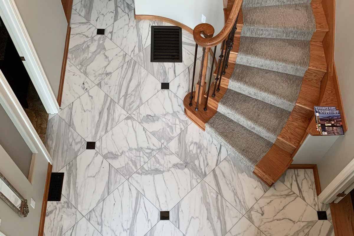 Marble Tile Flooring in a hall with stairs