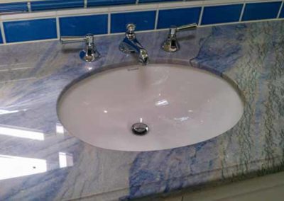 Sink with a blue countertop