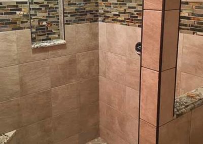 Tiled shower with a beautiful backsplash