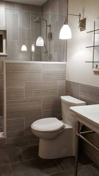Beautiful restroom with soft lightning and grey tiles
